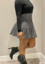 HOUNDSTOOTH PLEATED SKIRT